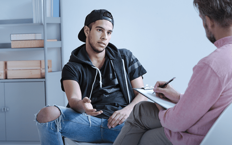 young man and counselor